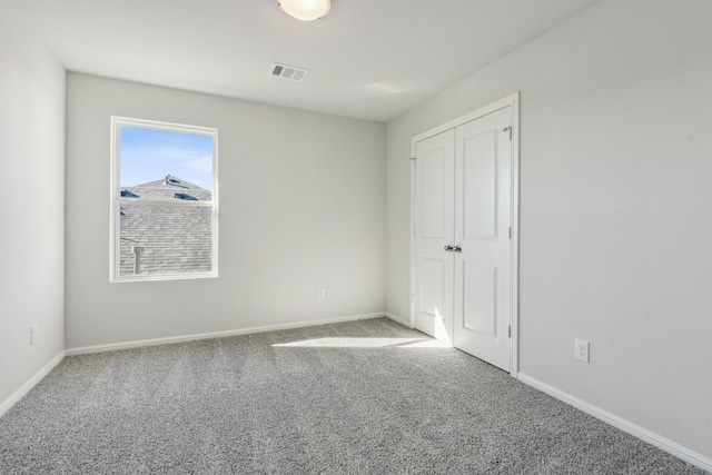 unfurnished bedroom featuring carpet