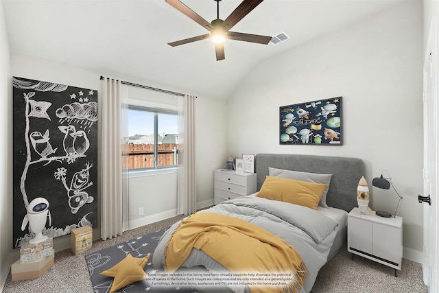 carpeted bedroom featuring vaulted ceiling and ceiling fan