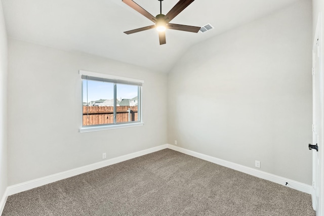 spare room with ceiling fan, carpet, and lofted ceiling