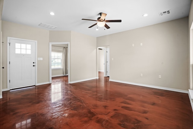 foyer entrance featuring ceiling fan