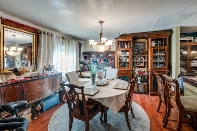 1606 Hill St, Grand Prairie, TX 75050 - dining space featuring a chandelier and wood finished floors