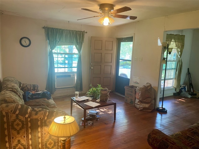 living room with cooling unit, hardwood / wood-style floors, and ceiling fan