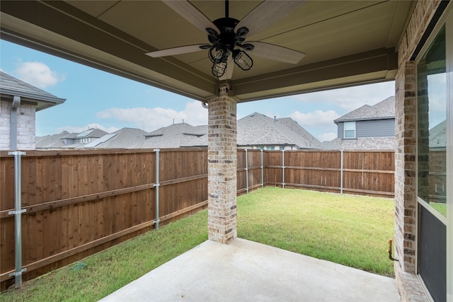 view of yard featuring a patio and ceiling fan