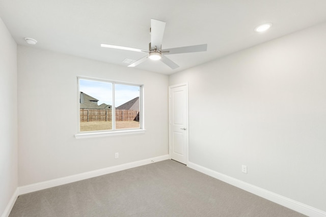 empty room with carpet and ceiling fan