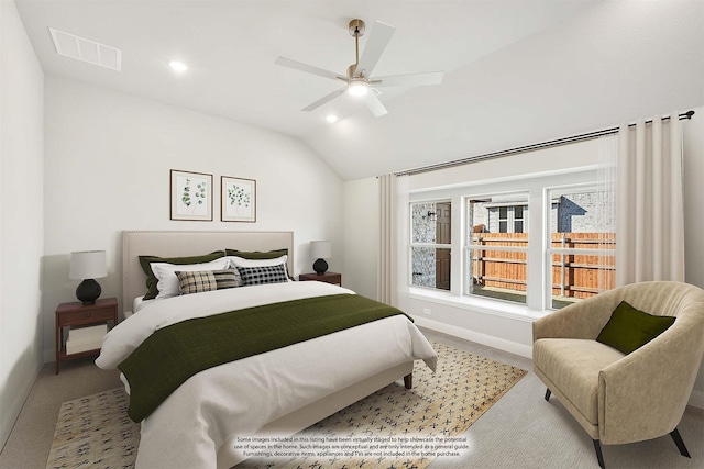 bedroom featuring lofted ceiling, carpet floors, and ceiling fan