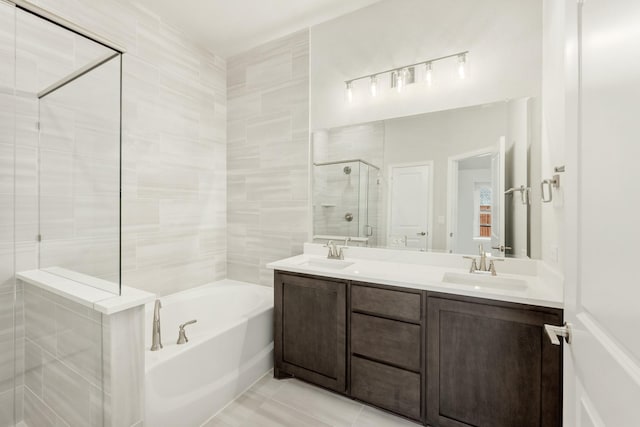 bathroom with tile patterned floors, vanity, and plus walk in shower