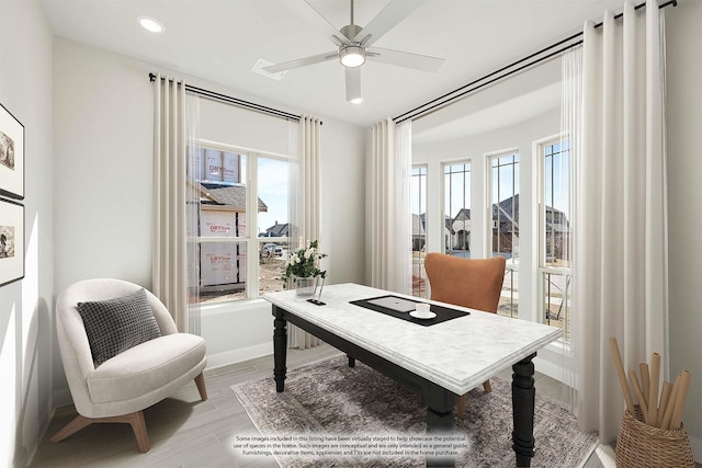 office featuring hardwood / wood-style flooring and ceiling fan