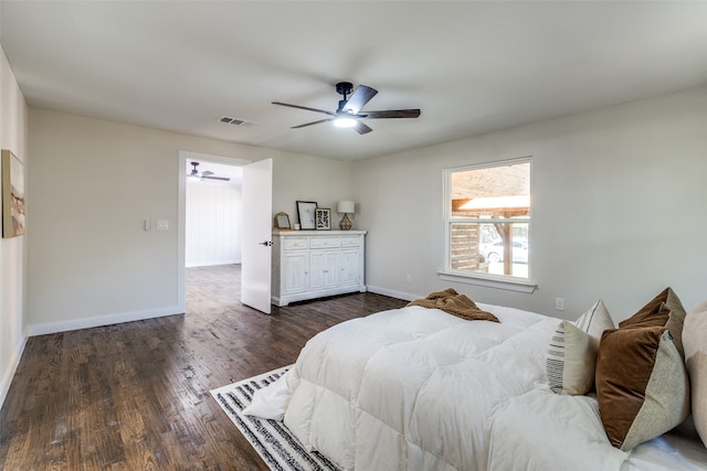 bedroom featuring ceiling fan and dark hardwood / wood-style flooring