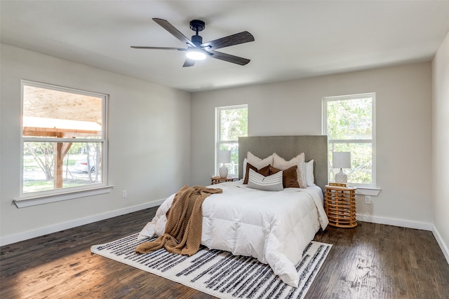 bedroom featuring ceiling fan and dark wood-type flooring