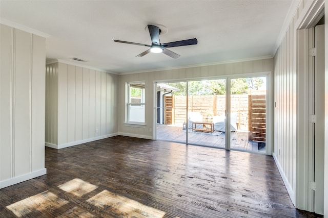 interior space featuring ceiling fan, crown molding, and dark hardwood / wood-style floors