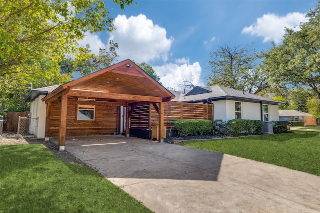 view of front of house with a front yard and a carport