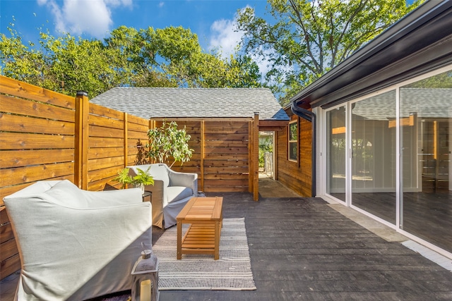 wooden terrace with outdoor lounge area