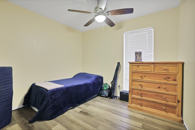 bedroom featuring light wood-type flooring and ceiling fan