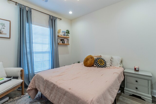 bedroom featuring dark wood-type flooring