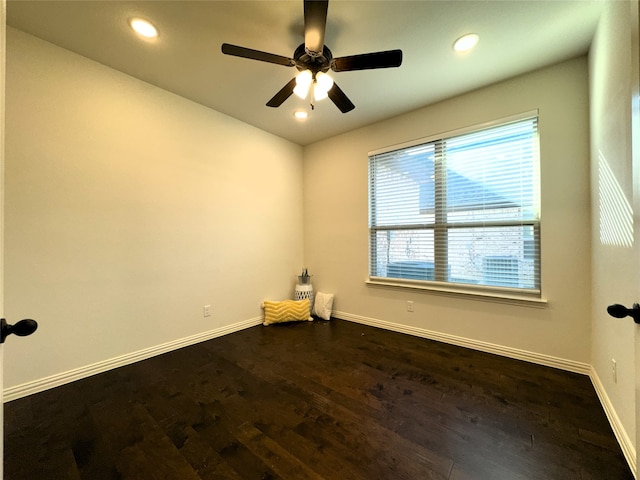 unfurnished room featuring dark hardwood / wood-style floors and ceiling fan