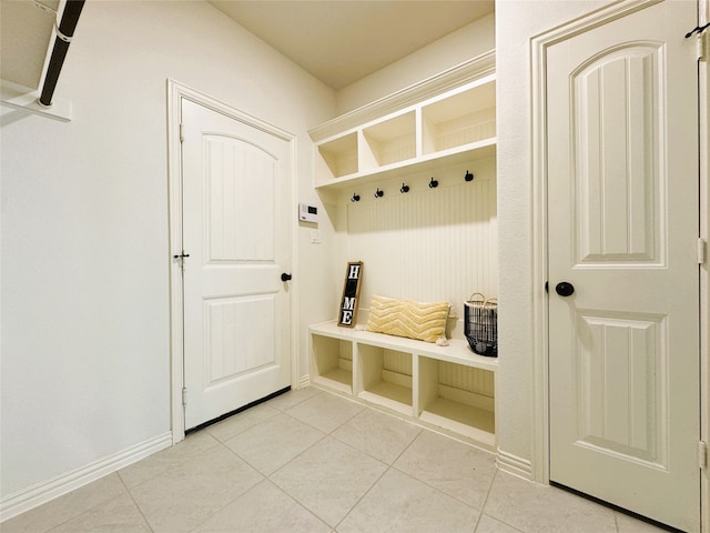 mudroom with light tile patterned flooring