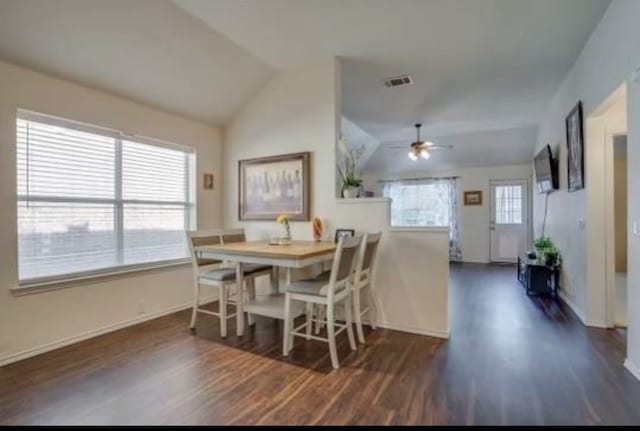 dining area featuring a wealth of natural light, lofted ceiling, ceiling fan, and dark hardwood / wood-style floors