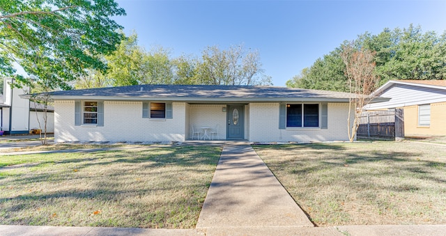 single story home with a front yard