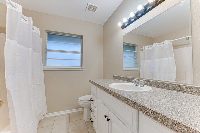 bathroom with vanity, tile patterned flooring, toilet, and a shower with curtain