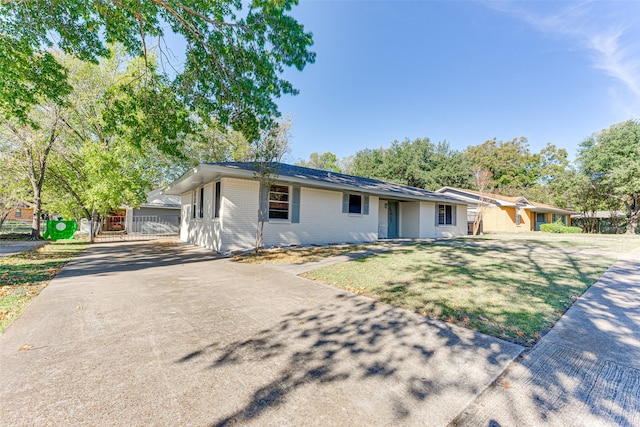 ranch-style home with a front yard