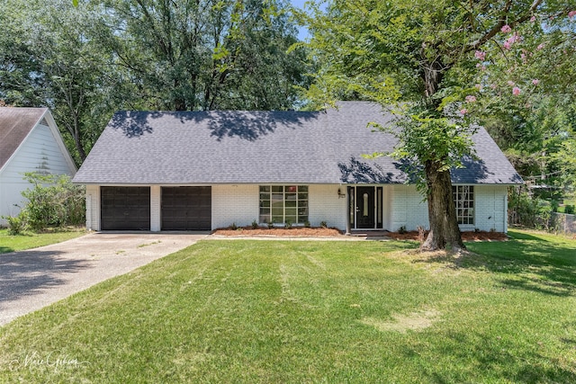 ranch-style house with a garage and a front yard