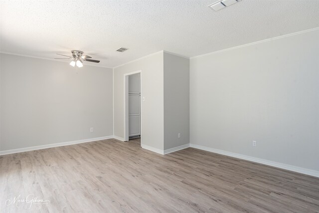 unfurnished bedroom featuring a closet, ornamental molding, a textured ceiling, ceiling fan, and light hardwood / wood-style flooring