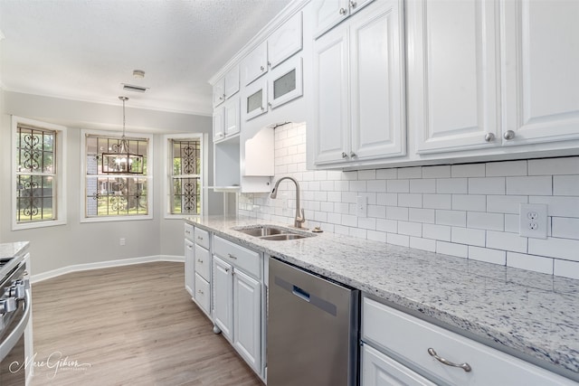 2011 Crabapple, Shreveport, LA 71118 - kitchen featuring stainless steel dishwasher, white cabinetry, decorative backsplash, light wood finished floors, and ornamental molding
