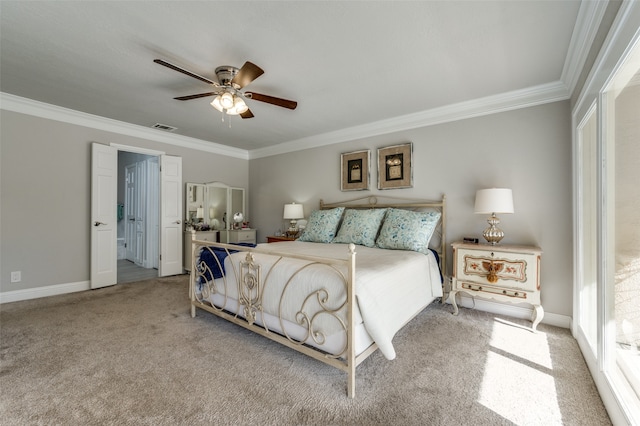 carpeted bedroom with ornamental molding and ceiling fan