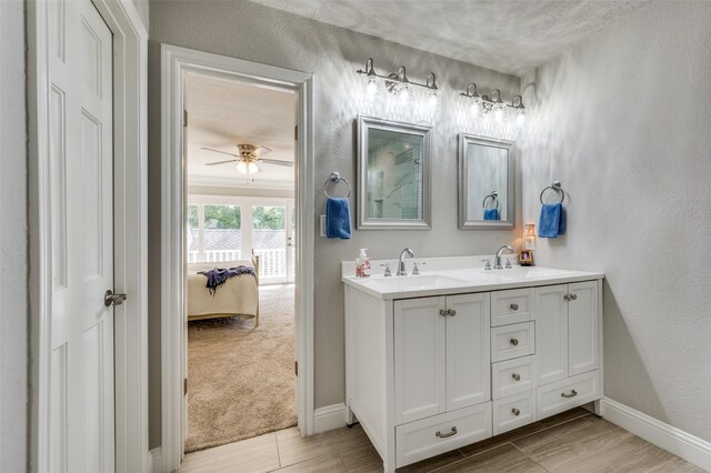 bathroom with vanity, hardwood / wood-style floors, and ceiling fan