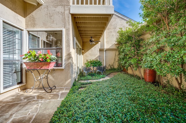 exterior space with ceiling fan