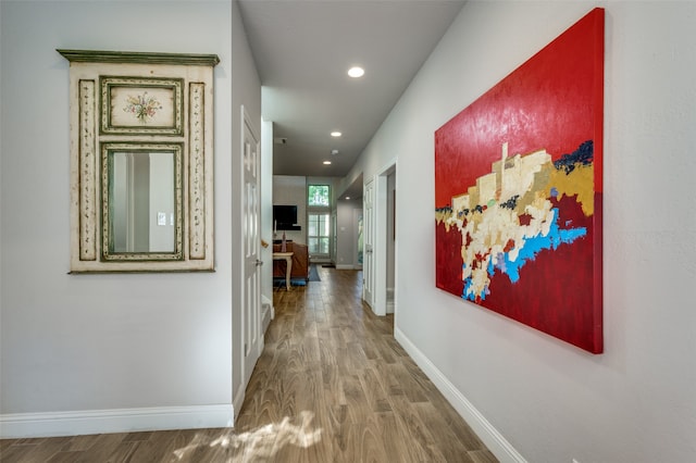 hallway with wood-type flooring