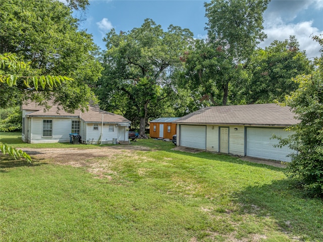 view of yard with a garage