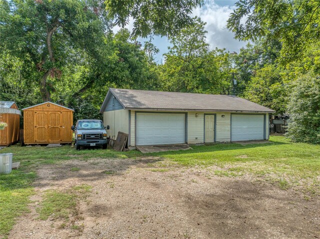 garage with a lawn