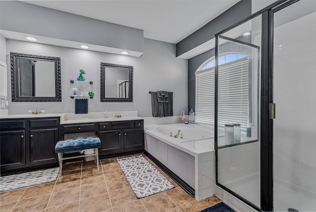 bathroom with separate shower and tub, tile patterned floors, and vanity