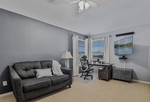 office space with light carpet, ceiling fan, and lofted ceiling