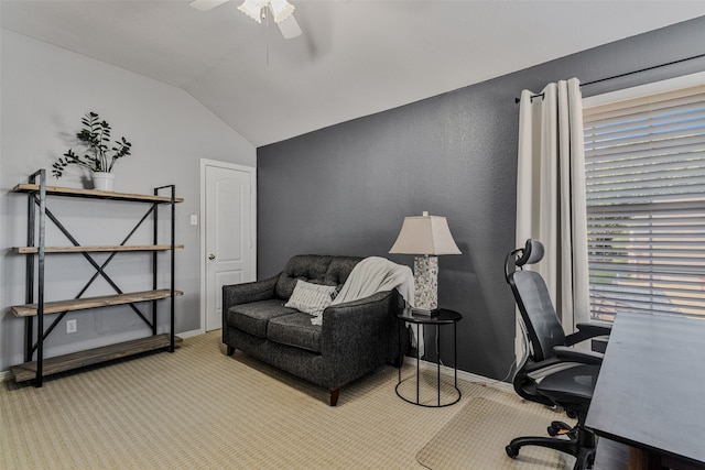 office space featuring light colored carpet, ceiling fan, and lofted ceiling