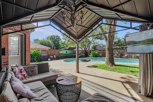 view of patio with a fenced in pool and an outdoor hangout area