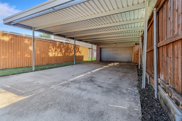 view of parking featuring a garage and a carport