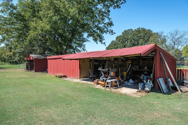 view of outbuilding featuring a yard