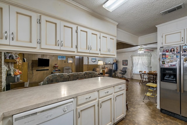 kitchen featuring white dishwasher, wooden walls, stainless steel fridge with ice dispenser, and ceiling fan