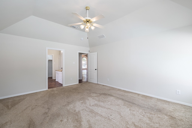 unfurnished bedroom with ensuite bath, ceiling fan, carpet floors, and lofted ceiling