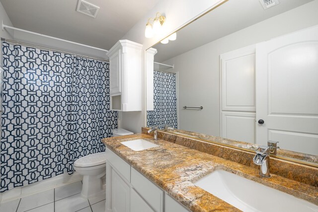 bathroom featuring vanity, tile patterned flooring, a shower with shower curtain, toilet, and ornate columns