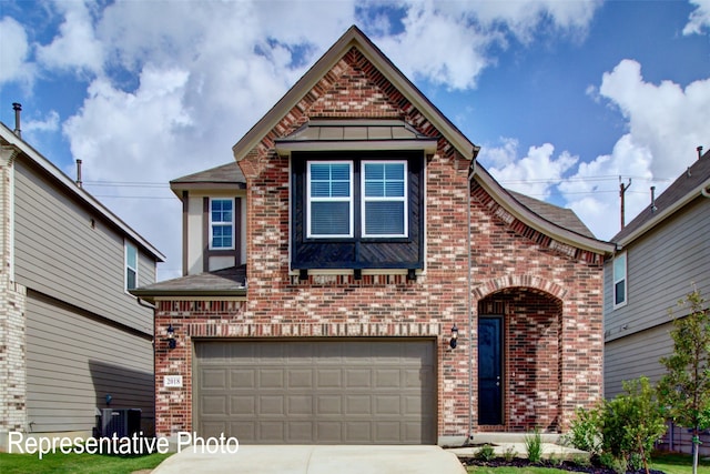 view of front of home with a garage and central AC unit