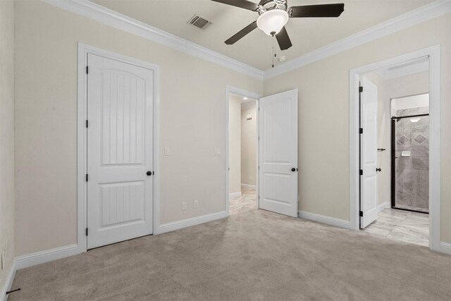 unfurnished bedroom featuring light colored carpet, ceiling fan, and crown molding