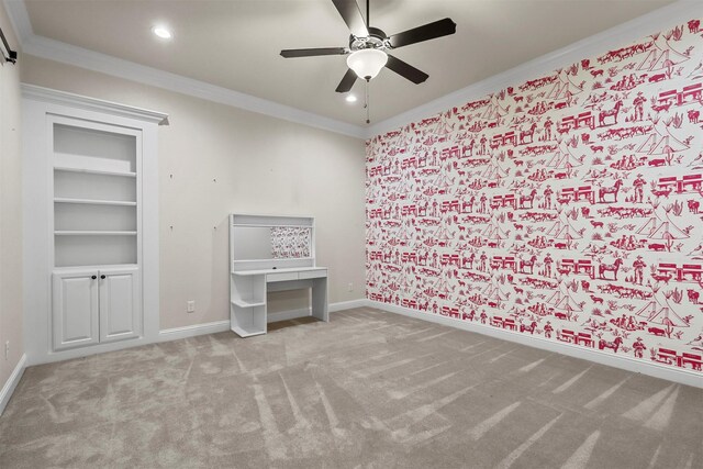 unfurnished bedroom featuring ornamental molding, light carpet, and ceiling fan