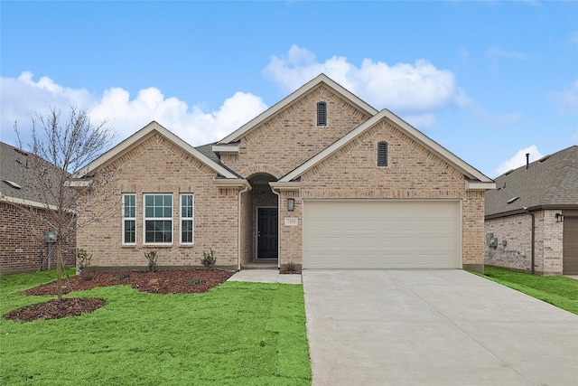 view of front of house featuring a front yard, concrete driveway, brick siding, and an attached garage