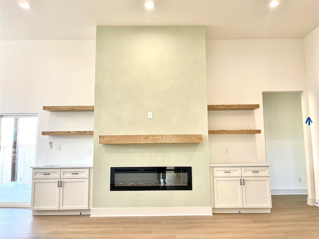 unfurnished living room with light hardwood / wood-style floors