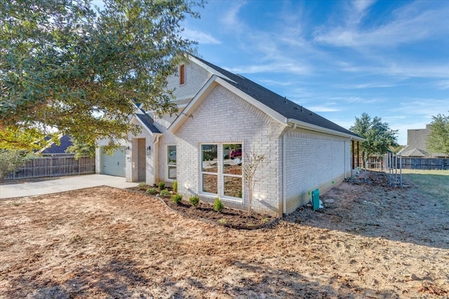 view of property exterior featuring a garage