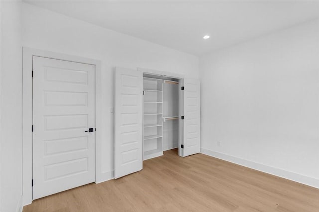 unfurnished bedroom with light hardwood / wood-style floors