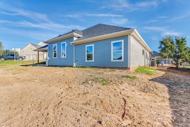 rear view of house with cooling unit